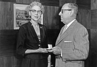 Ethel Bengel, the company’s first employee, receiving her 25th Anniversary pin.
