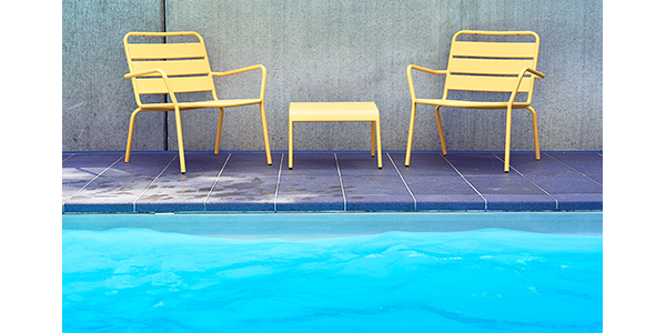 lawn chairs by pool