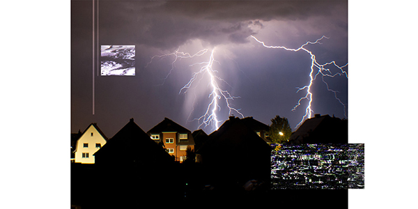lightning strikes behind houses