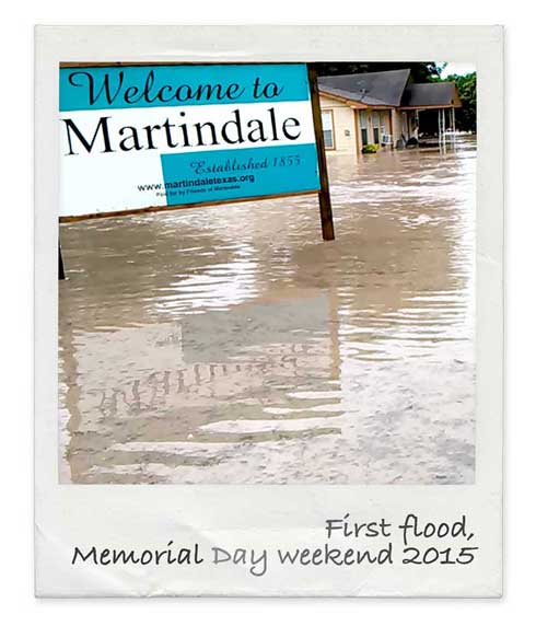 Town of Martindale welcome sign surrounded by flood water, Memorial Day 2015 