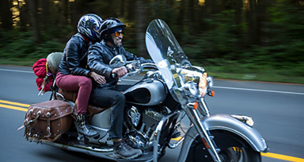 Rider with passenger on Touring motorcycle