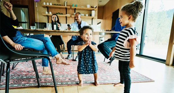 family relaxes near diner table
