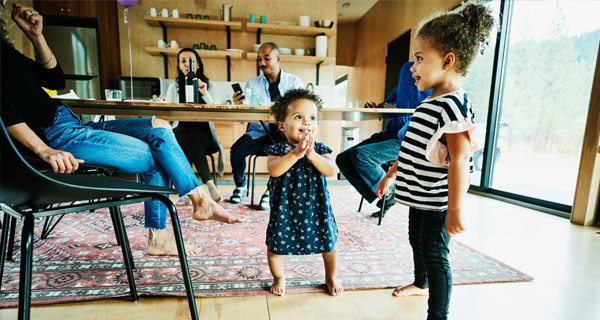 family relaxes near diner table
