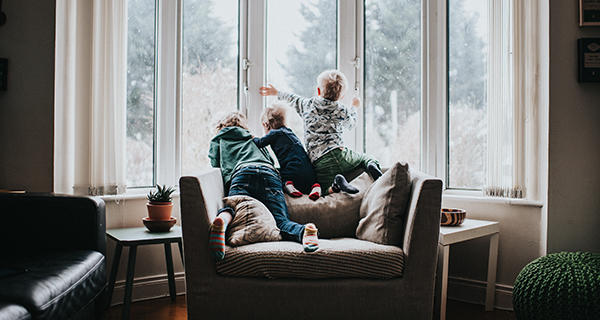 kids play by house window