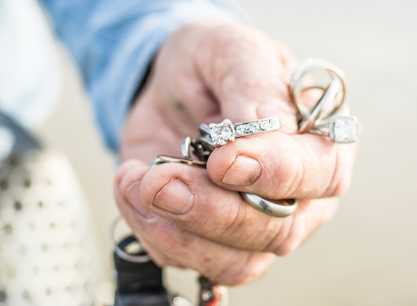Stan Ross holding several rings