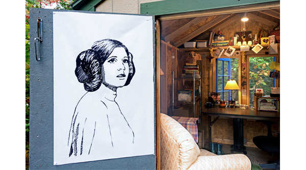 shack with illustration on the door