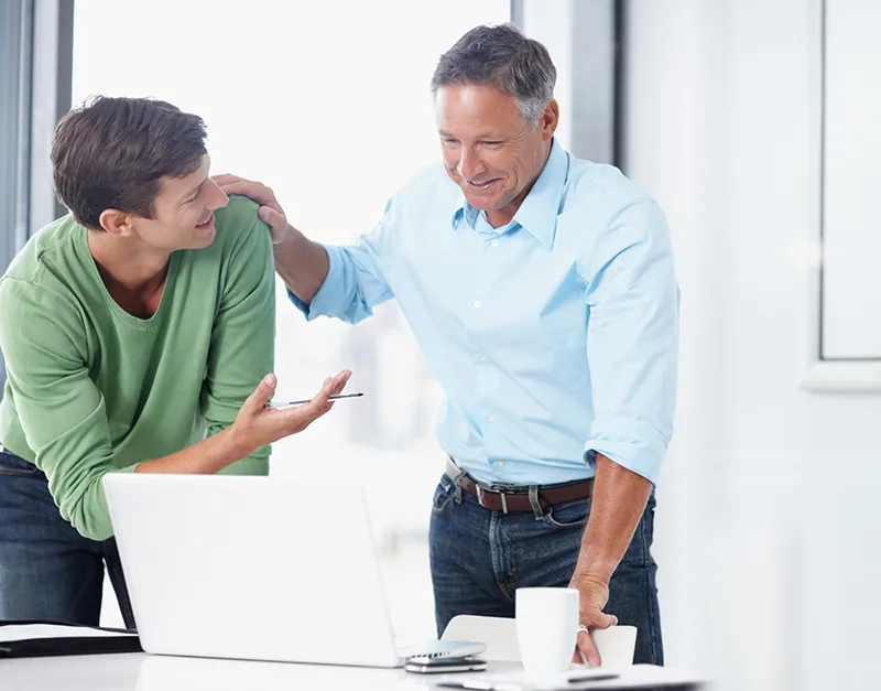 A Farmers agency owner mentoring a Protégé producer.